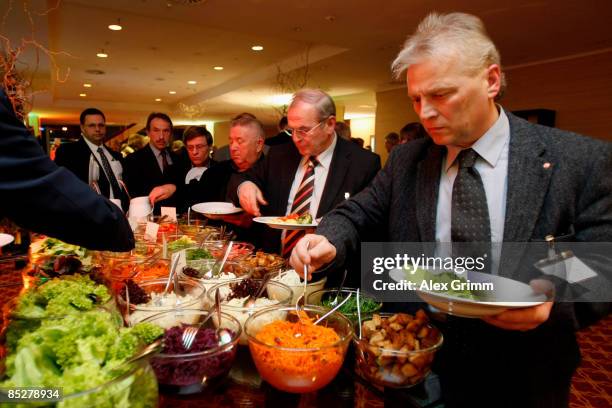 People stand at the buffet during the DFB LIVE event in the Marriott Hotel on March 6, 2009 in Frankfurt am Main, Germany