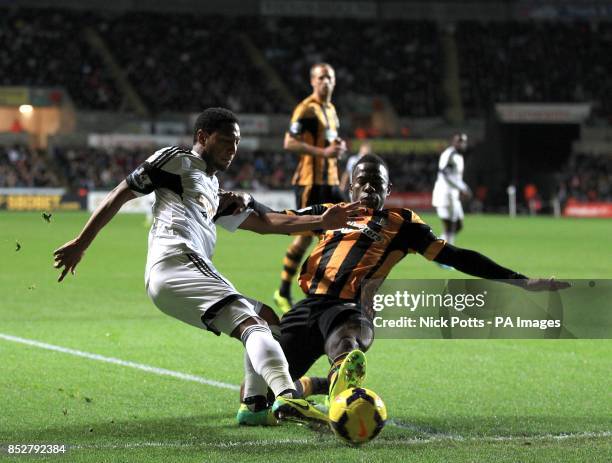 Swansea City's Jonathan de Guzman and Hull City's Maynor Figueroa battle for the ball