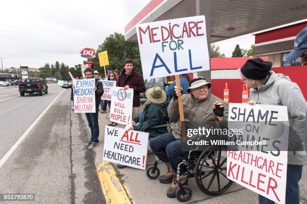 Protesters hold a small peaceful demonstration in support of health care on September 23, 2017 in Livingston, Montana. The state of Montana expanded...