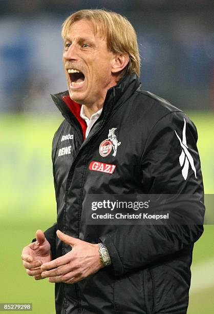 Head coach Christoph Daum of Koeln shouts at his team during the Bundesliga match between FC Schalke 04 and 1. FC Koeln at the Veltins-Arena on March...