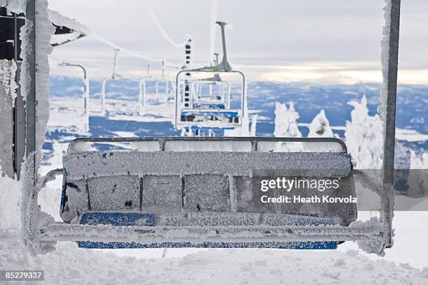 a frozen chairlift with valley. - whitefish montana stockfoto's en -beelden