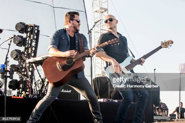 Mike Eli and Jon Jones of the Eli Young Band perform at Coastal Country Jam at Huntington State Beach on September 23, 2017 in Huntington Beach,...