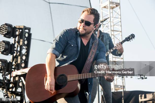 Mike Eli of the Eli Young Band performs at Coastal Country Jam at Huntington State Beach on September 23, 2017 in Huntington Beach, California.
