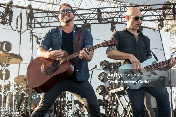 Mike Eli and Jon Jones of the Eli Young Band perform at Coastal Country Jam at Huntington State Beach on September 23, 2017 in Huntington Beach,...