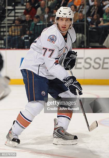 Tom Gilbert of the Edmonton Oilers skates against the Nashville Predators at the Sommet Center on March 3, 2009 in Nashville, Tennessee.