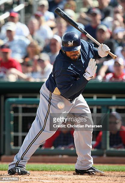 Prince Fielder of the Milwaukee Brewers is hit by a pitch during the fourth inning of the spring training game against the Cleveland Indians at...