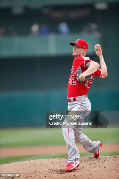 Parker Bridwell of the Los Angeles Angels of Anaheim pitches during the game against the Oakland Athletics at the Oakland Alameda Coliseum on...