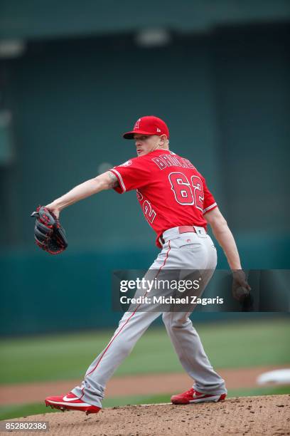 Parker Bridwell of the Los Angeles Angels of Anaheim pitches during the game against the Oakland Athletics at the Oakland Alameda Coliseum on...