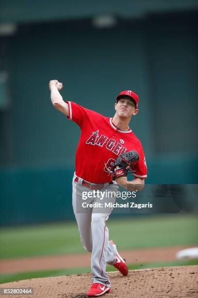 Parker Bridwell of the Los Angeles Angels of Anaheim pitches during the game against the Oakland Athletics at the Oakland Alameda Coliseum on...