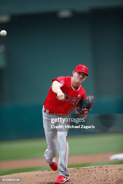 Parker Bridwell of the Los Angeles Angels of Anaheim pitches during the game against the Oakland Athletics at the Oakland Alameda Coliseum on...