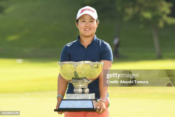 Nasa Hataoka of Japan poses with the trophy after winning the Miyagi TV Cup Dunlop Ladies Open 2017 at the Rifu Golf Club on September 24, 2017 in...