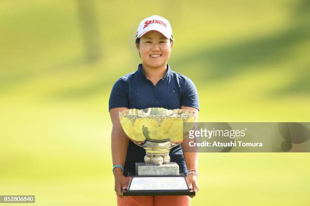 Nasa Hataoka of Japan poses with the trophy after winning the Miyagi TV Cup Dunlop Ladies Open 2017 at the Rifu Golf Club on September 24, 2017 in...