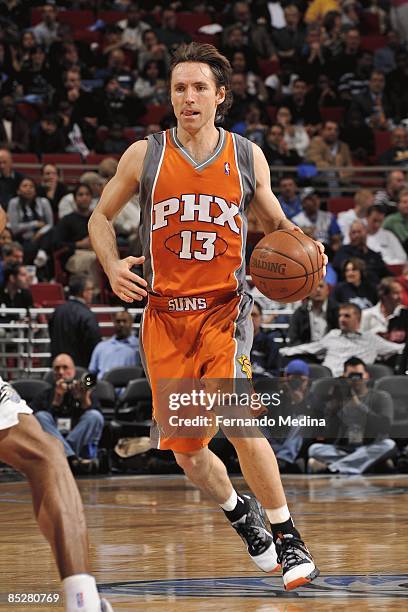 Steve Nash of the Phoenix Suns drives up the court against the Orlando Magic during the game on March 3, 2009 at Amway Arena in Orlando, Florida. The...