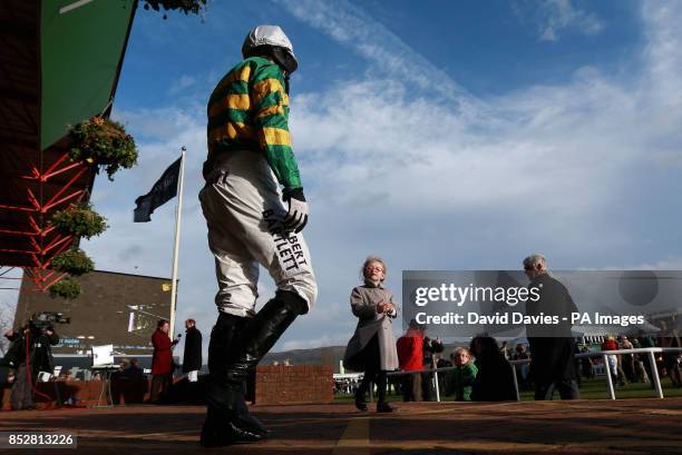Tony McCoy is greeted by his daughter Eve as he makes his way out for the Jenny Mould Memorial Handicap Chase during day two of the 2013 The...
