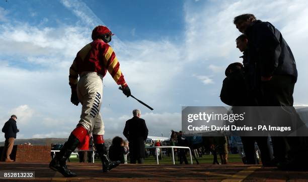 Richard Johnson makes his way out for the Jenny Mould Memorial Handicap Chase during day two of the 2013 The International at Cheltenham Racecourse,...