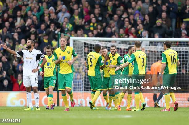 Norwich City's Gary Hooper celebrates scoring their first goal of the game with team-mates