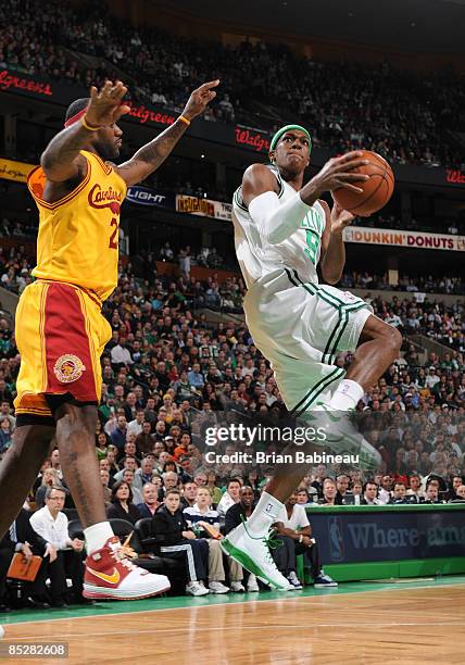 Rajon Rondo of the Boston Celtics drives the lane against LeBron James of the Cleveland Cavaliers during the game on March 6, 2009 at the TD...