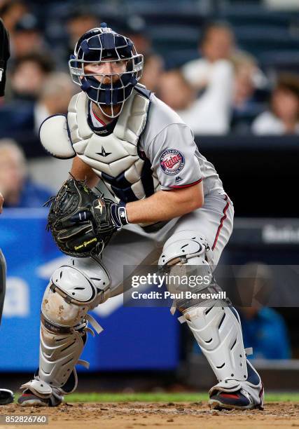 Catcher Chris Gimenez of the Minnesota Twins looks to throw to first base in an MLB baseball game against the New York Yankees on September 19, 2017...