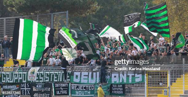 Fans of Muenster with flags during the 3.Liga match between FC Carl Zeiss Jena and SC Preussen Muenster at Ernst-Abbe Sportfeld on September 23, 2017...