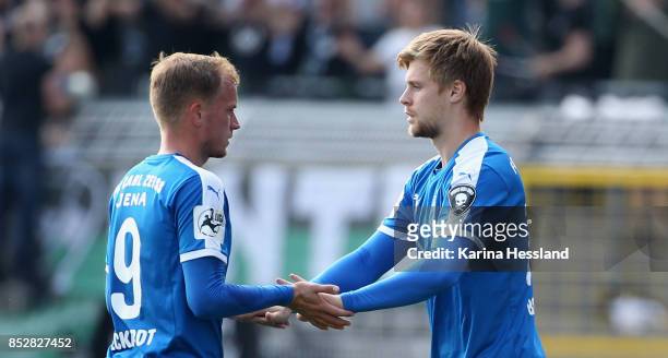 Rene Eckardt and Dominik Bock of Jena during substitudes during the 3.Liga match between FC Carl Zeiss Jena and SC Preussen Muenster at Ernst-Abbe...