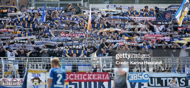 Fans of Jena with scarves during the 3.Liga match between FC Carl Zeiss Jena and SC Preussen Muenster at Ernst-Abbe Sportfeld on September 23, 2017...