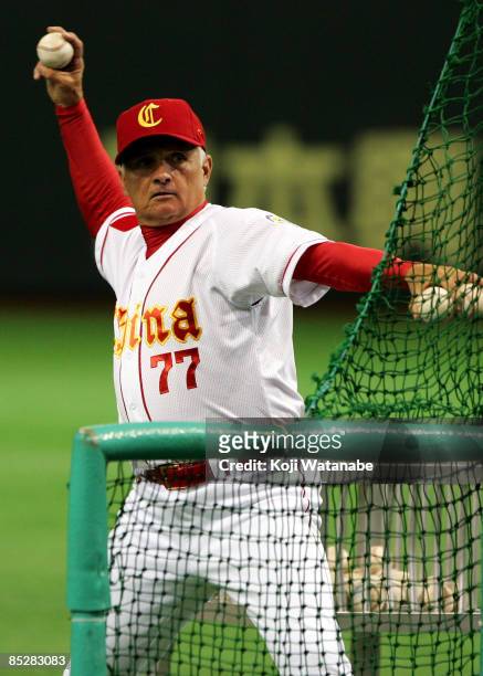 Manager Terry Collins of Team China throws to players warming-up prior to Game 3 of the 2009 World Baseball Classic Pool A match between China and...