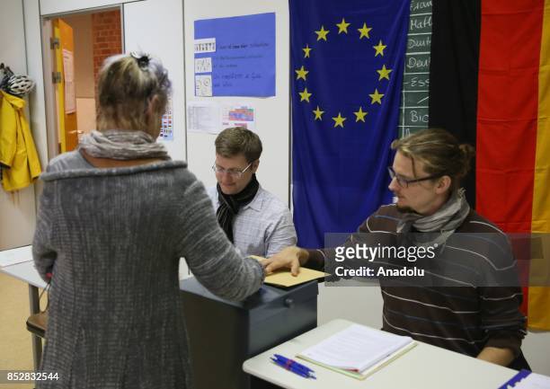German voters cast their ballots in German federal elections at a polling station in Berlin, Germany on September 24, 2017. 61.5 million people...