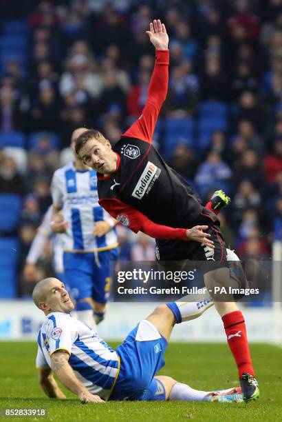 Brighton's Adam El-Abd challenges Huddersfield's Paul Dixon during the Sky Bet Championship match at the AMEX Stadium, Brighton.