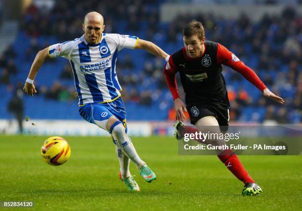 Brighton's Bruno Saltor challenges Huddersfield's Paul Dixon during the Sky Bet Championship match at the AMEX Stadium, Brighton.