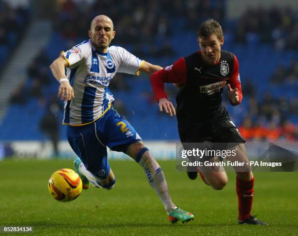 Brighton's Bruno Saltor challenges Huddersfield's Paul Dixon during the Sky Bet Championship match at the AMEX Stadium, Brighton.