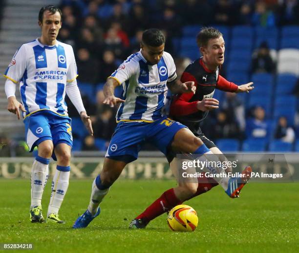 Brighton's Liam Bridcutt challenges Huddersfield's Paul Dixon during the Sky Bet Championship match at the AMEX Stadium, Brighton.