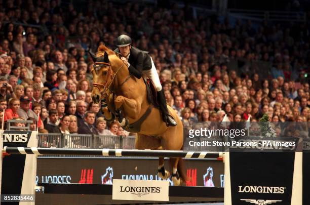 Great Britain's Daniel Neilson riding Varo M competes in the Longines FEI World Cup during day six of The London International Horse Show at the...