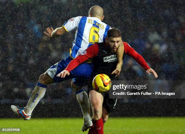 Huddersfield's Adam Clayton is challenged by Brighton's Adam El-Abd during the Sky Bet Championship match at the AMEX Stadium, Brighton.