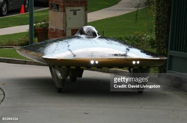 Driven by designer Marcelo da Luz, the Solar XOF1 car arrives during a reception at the official residence of the Consul General of Canada on March...