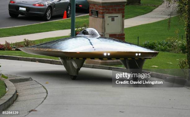 Driven by designer Marcelo da Luz, the Solar XOF1 car arrives during a reception at the official residence of the Consul General of Canada on March...