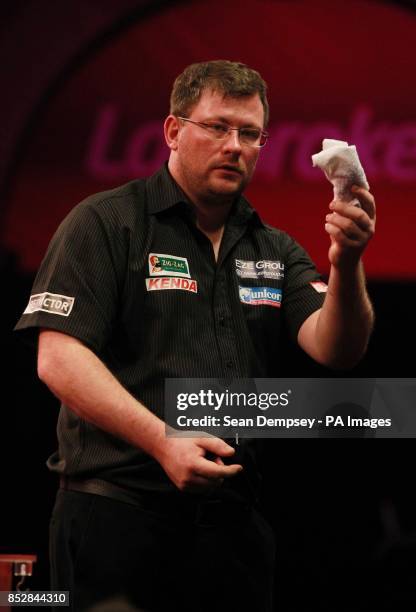 James Wade wins a very close match during day seven of The Ladbrokes World Darts Championship at Alexandra Palace, London.