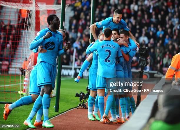 Tottenham Hotspurs's Danny Rose is mobbed by his team mates after Southampton's Jos Hooiveld own goal during the Barclays Premier League match at St...