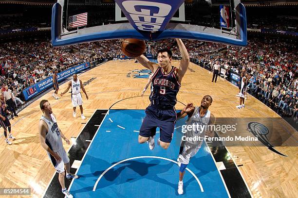 Yi Jianlian of the New Jersey Nets dunks against the Orlando Magic during the game on March 6, 2009 at Amway Arena in Orlando, Florida. NOTE TO USER:...