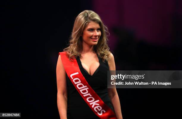 Ladbrokes walk on girl during day three of The Ladbrokes World Darts Championship at Alexandra Palace, London.