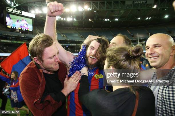 Toby Pinwill of Port Melbourne celebrates the win with friends during the VFL Grand Final match between Richmond and Port Melbourne at Etihad Stadium...