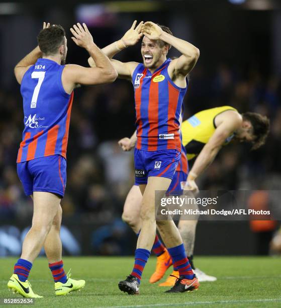 Dylan Conway and Hugh Sandilands of Port Melbourne celebrate the win after Ben Lennon of the Tigers missed a kick for goal that could have won...