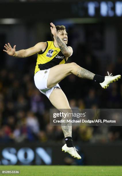 Ben Lennon of the Tigers kicks the ball but missed the goal after the siren that could have won Richmond the match during the VFL Grand Final match...