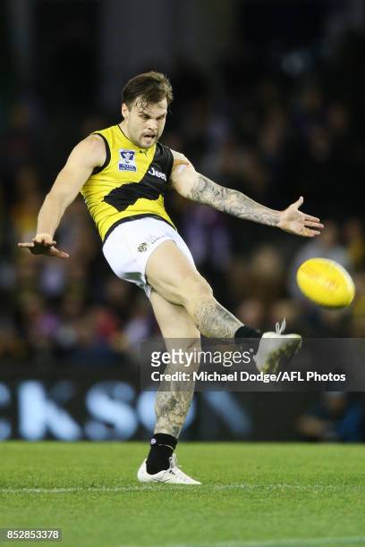 Ben Lennon of the Tigers kicks the ball but missed the goal after the siren that could have won Richmond the match during the VFL Grand Final match...