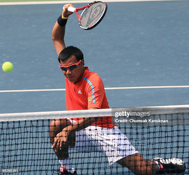 Sonchat Ratiwatana of Thailand returns a shot to Chris Guccione and Carsten Ball of Australia during day two of the Davis Cup Asia/Oceania Group I...