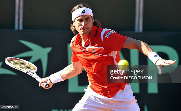 Spaniard David Ferrer returns the ball to Serb Novak Djokovic during the first match of the Davis Cup in Benidorm on March 7, 2009. Spain are the...