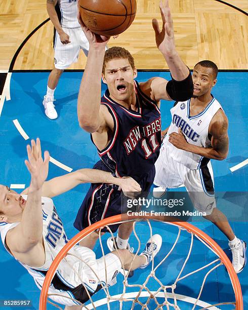 Brook Lopez of the New Jersey Nets shoots against the Orlando Magic during the game on March 6, 2009 at Amway Arena in Orlando, Florida. NOTE TO...