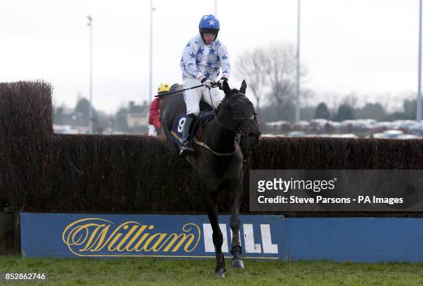 Roger Beantown ridden by David Crosse during the William Hill - Download The App Novices' Limited Handicap Steeple Chase during Day One of the...