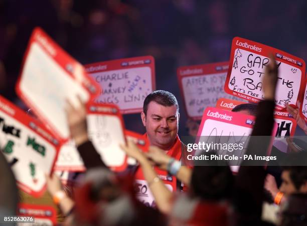 Wes Newton walks out against Robert Thornton in the Third round during day twelve of The Ladbrokes World Darts Championship at Alexandra Palace,...