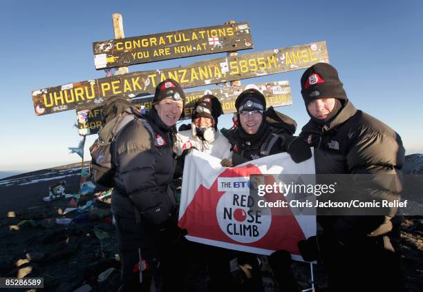 Ben Shephard, Kimberley Walsh, Ronan Keating and Gary Barlow pose on the top of Mount Kilimanjaro on the seventh day of The BT Red Nose Climb of...