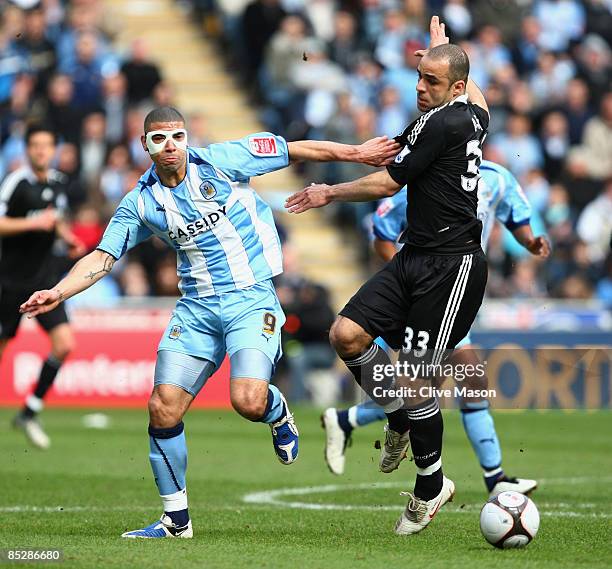 Alex of Chelsea battlles with Leon Best of Coventry City during the FA Cup Sponsored by E.ON 6th round match between Coventry City and Chelsea at the...